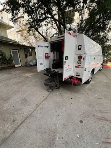 Magnet Plumbing service vehicle on-site for Grease Trap Cleaning in North Palm Trail